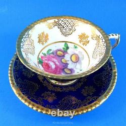 Cobalt and Gold Exterior with Floral Center on Beige Paragon Tea Cup and Saucer