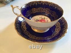 Signed paragon tea cup saucer cobalt blue pink flower gold gilt paint