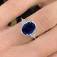 Bague De Fiançailles Ovale En Saphir Bleu Simulé Halo 2.50 Ct Plaqué Or Blanc 14 Carats