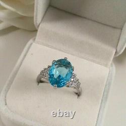 Bague de mariage pour femme en argent plaqué or blanc 14 carats avec topaze bleue simulée ovale de 2 carats