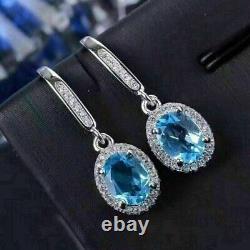 Boucle d'oreille pendante en forme de goutte, en topaze bleue simulée taillée en ovale, plaquée or blanc 14 carats