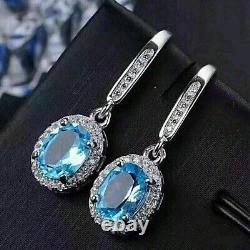 Boucle d'oreille pendante en forme de goutte, en topaze bleue simulée taillée en ovale, plaquée or blanc 14 carats