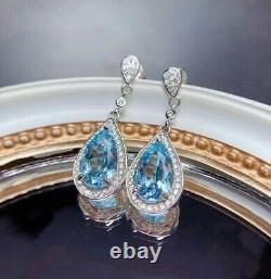 Boucle d'oreille pendantes pour femmes en forme de poire avec une imitation de topaze bleu 14 carats plaqué or blanc