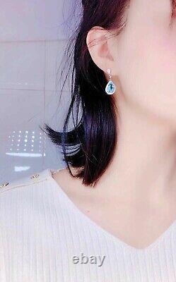 Boucle d'oreille pendantes pour femmes en forme de poire avec une imitation de topaze bleu 14 carats plaqué or blanc