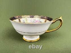 VTG Paragon sur rendez-vous 21130 Tasse à thé avec soucoupe en bleu cobalt et bordure dorée avec roses